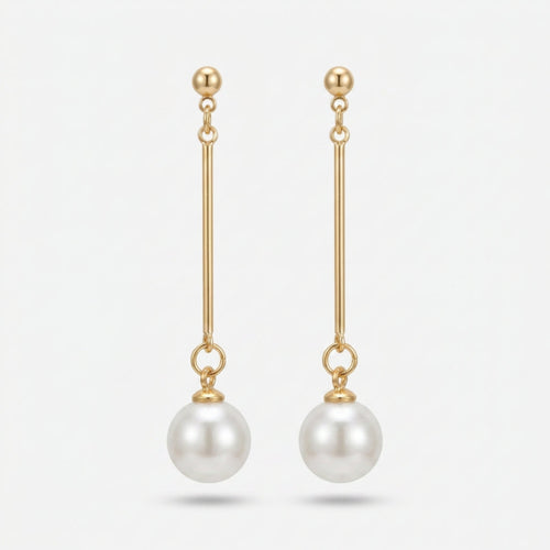 Elegante Lange Oorbellen met Parelhanger. Earrings by Tina