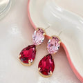 Roze Druppeloorbellen met lichtroze en donkerroze gefacetteerde steentjes.Earrings by Tina
